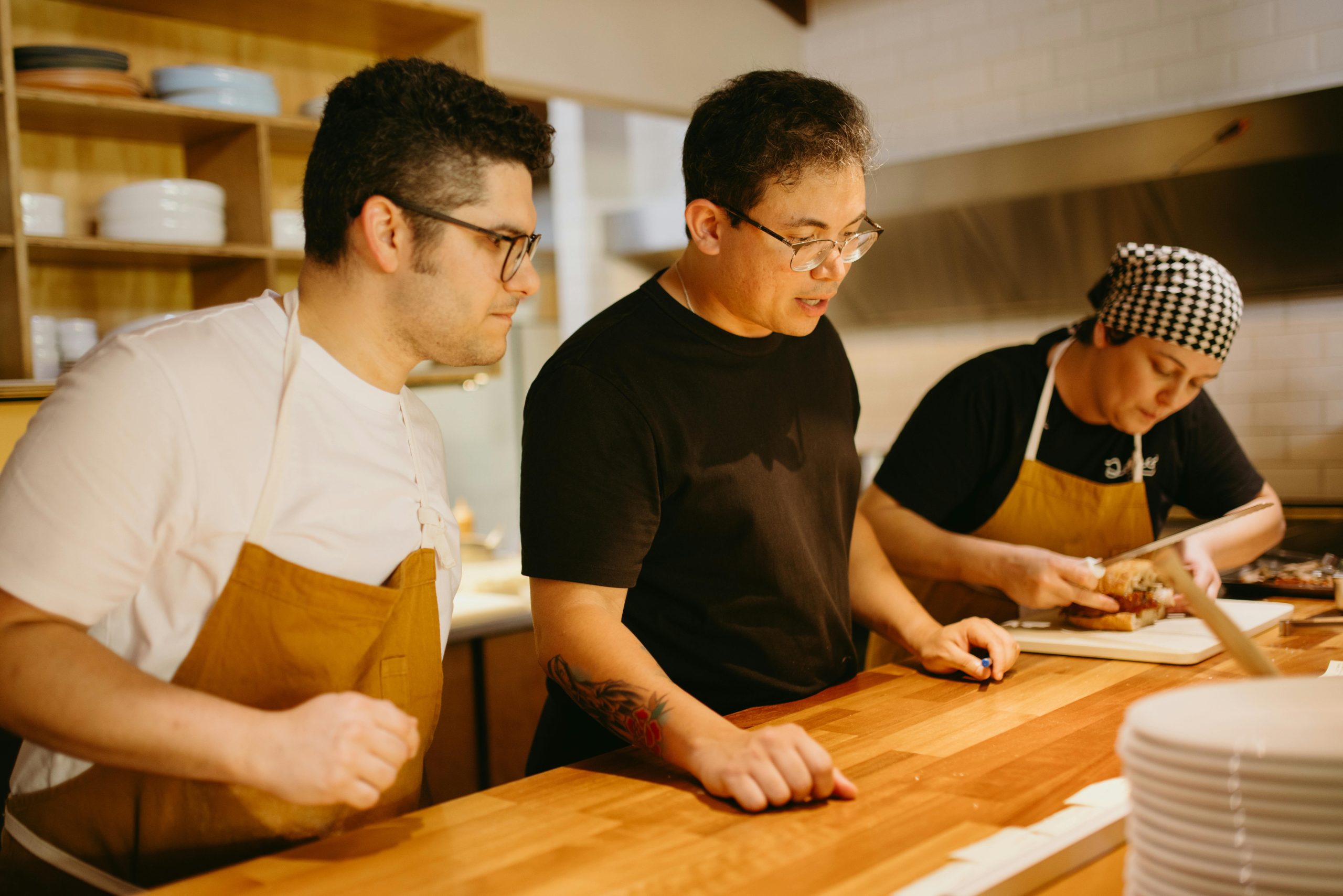 Restaurant team preparing catering orders with an organized system